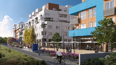 A street view of a residential area with people riding bicycles and walking on the sidewalk.
