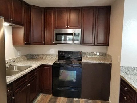 a kitchen with a stove and a microwave