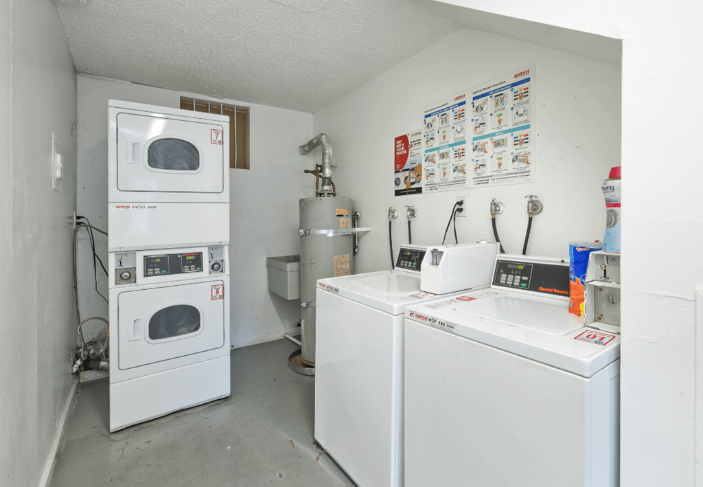 a laundry room with two washes and a washing machine