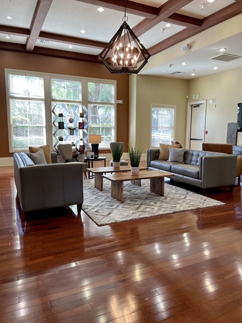 a large living room with couches and a table