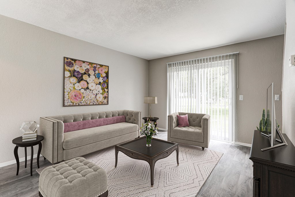 A living room with a couch, chair, and coffee table.