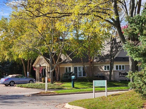 a house with a car parked in front of it