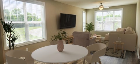 A living room with a white table and chairs, a flat screen TV, and a window with blinds.