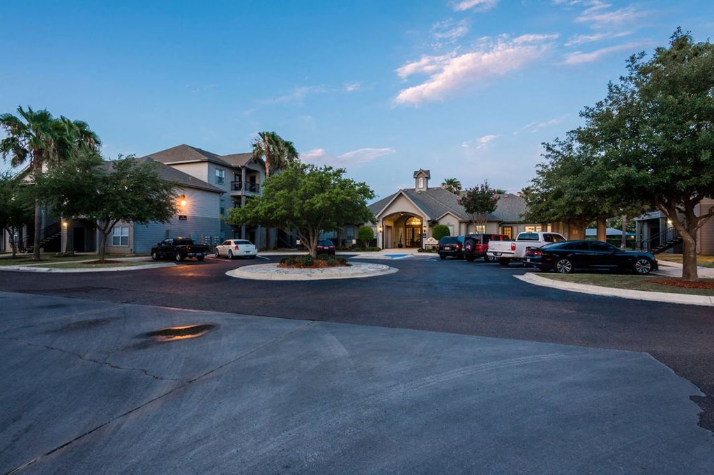 a street with cars parked in front of houses