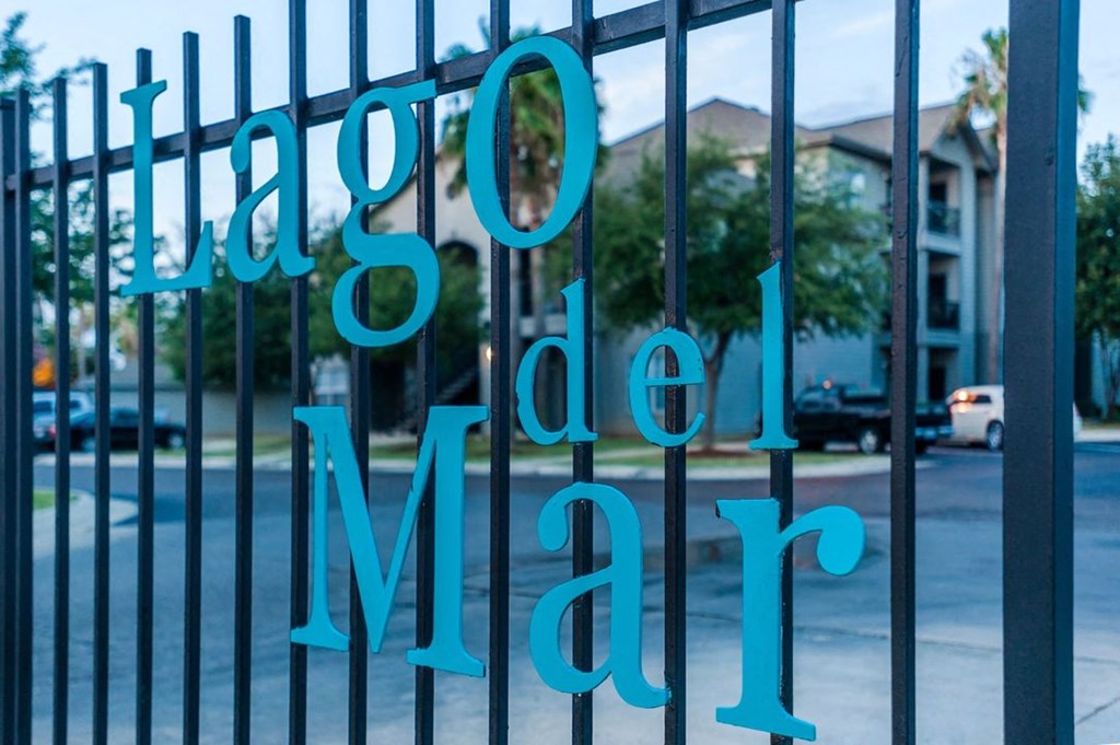 a gate with blue letters on it