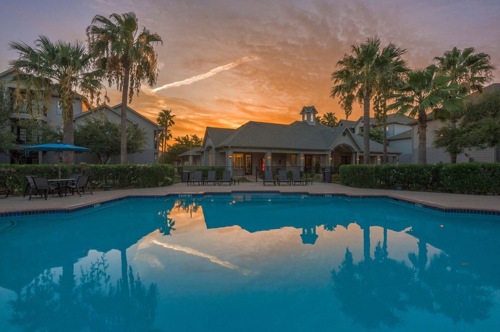 the pool at sunset at the villa apartments in palm springs