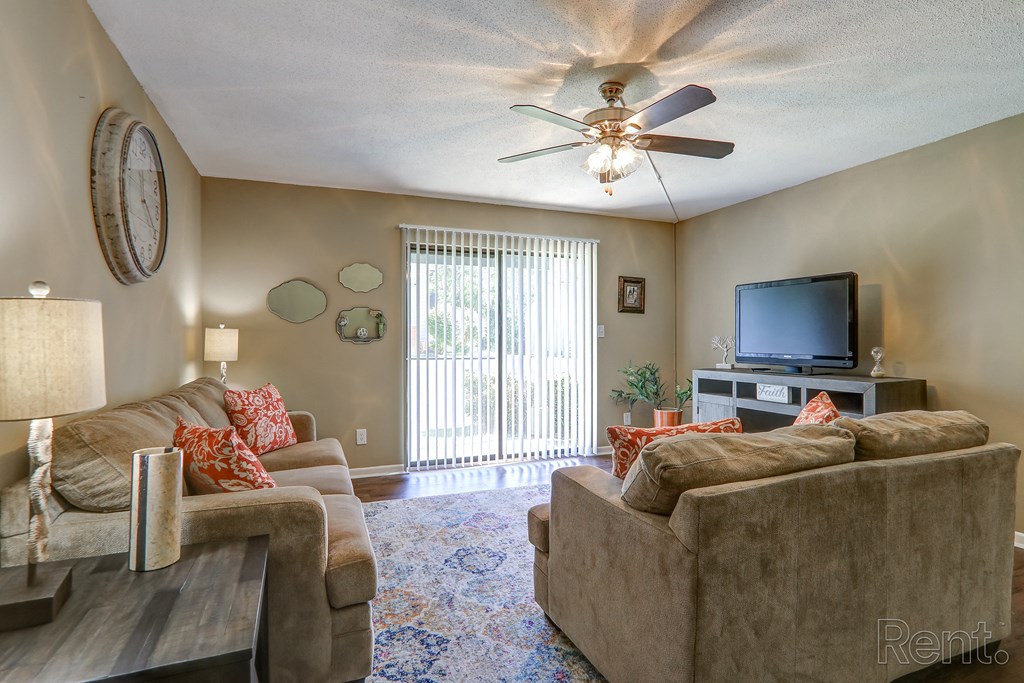 a living room with couches and a tv