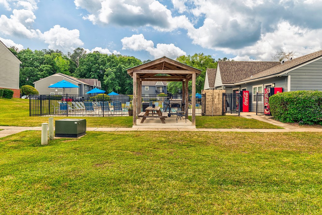 the yard and gazebo at the reserve at walnut creek apartments