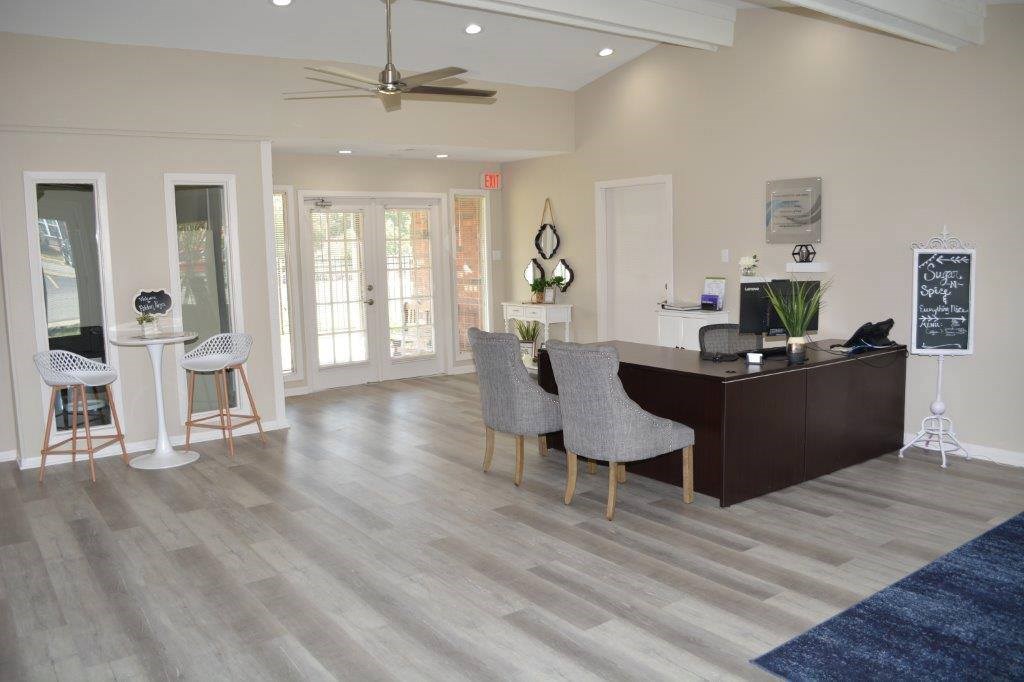 A reception area with a desk and chairs.