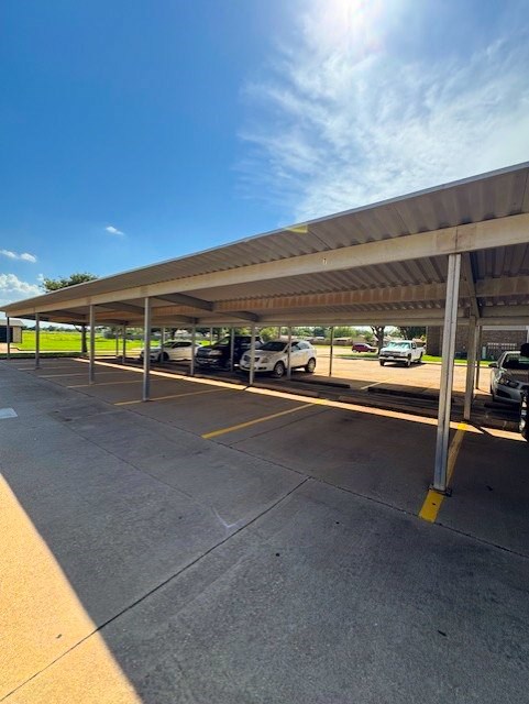 A parking lot with a large canopy over it.