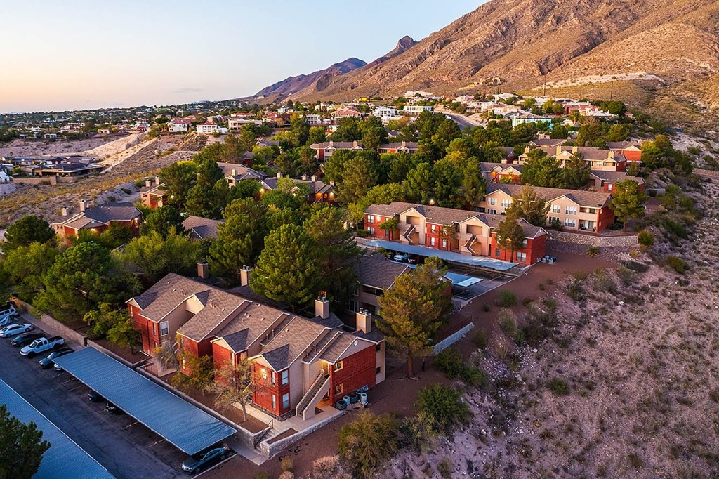 A small town with houses and a parking lot.