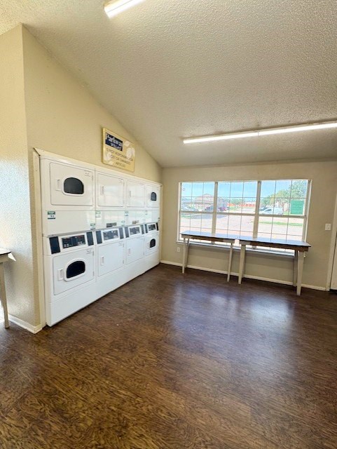 A laundry room with a washer and dryer stacked on top of each other.