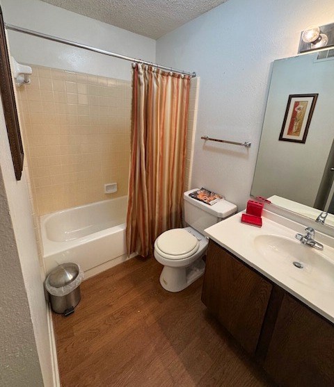 A bathroom with a toilet, sink, and shower.