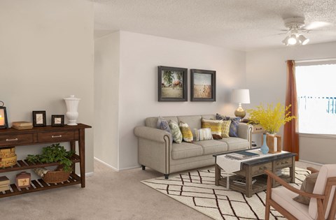 a living room with a couch and a table