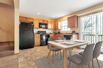 Patriot Pointe Townhomes Junction City, KS Furnished Dining and Kitchen Area - Photo Gallery 2