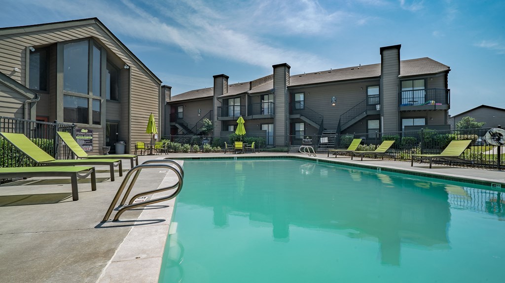 our apartments have a large swimming pool with lounge chairs