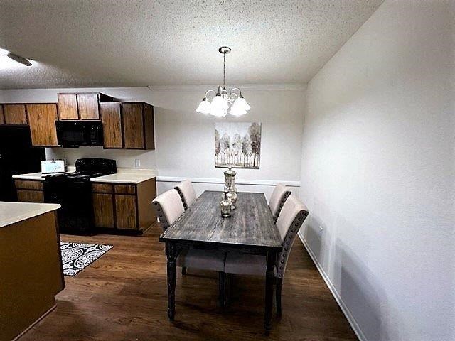 a dining room with a table and chairs