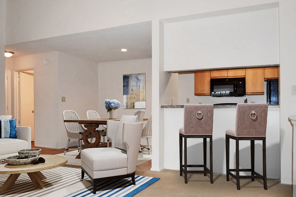 A modern living room with a bar area and a dining table.