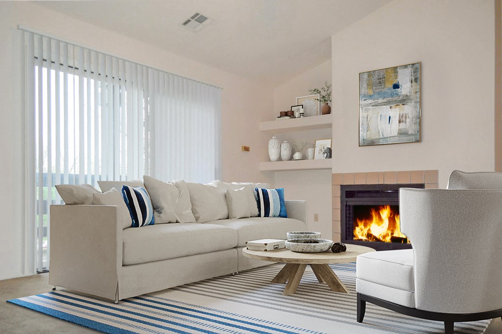 A living room with a fireplace and a couch.