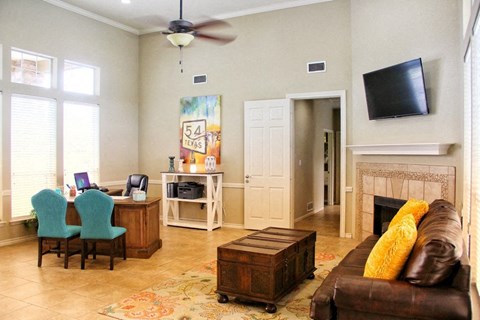 a living room with a couch and a tv