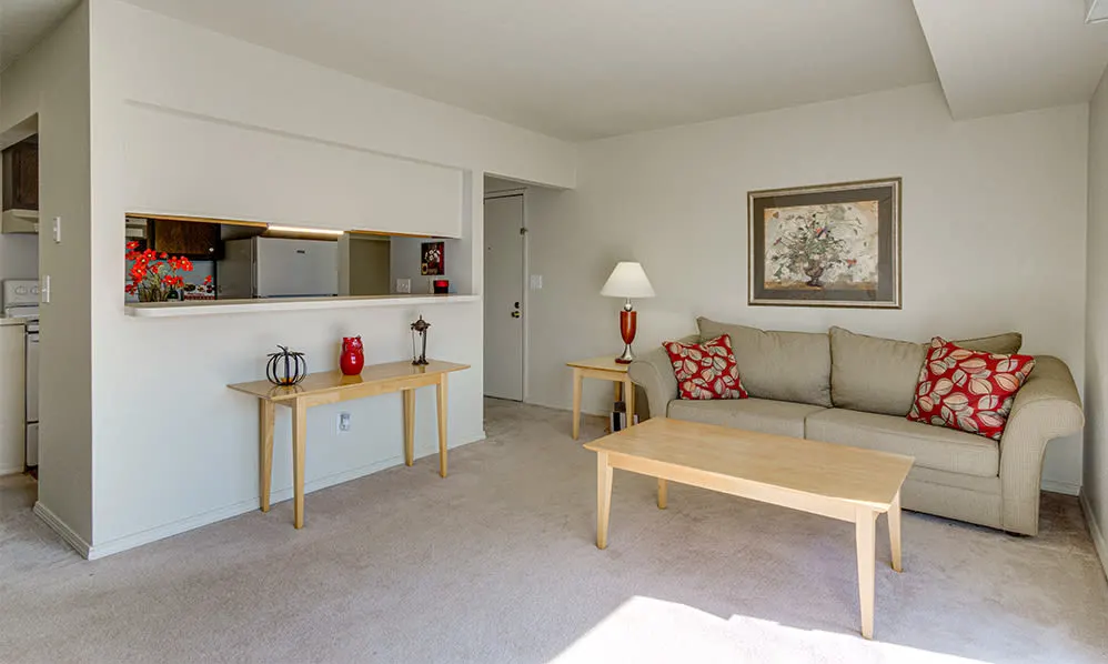 a living room with a couch and two tables