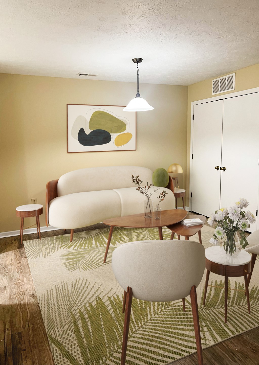 A living room with a white sofa, a wooden table, and a painting on the wall.
