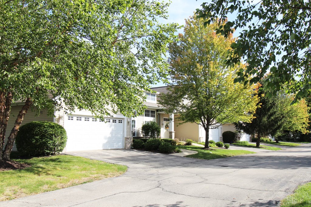 a house with a driveway and a white garage door