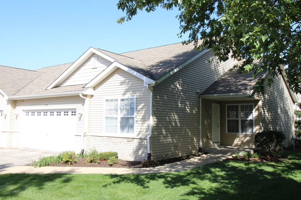 a white house with a white garage door
