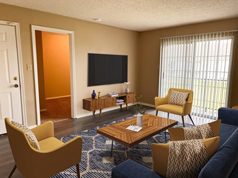 A living room with a yellow chair and a blue couch.