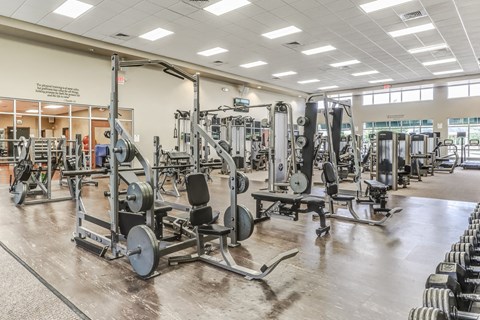 a fitness center with weights and other exercise equipment