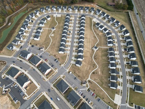 A suburban neighborhood with houses and streets.