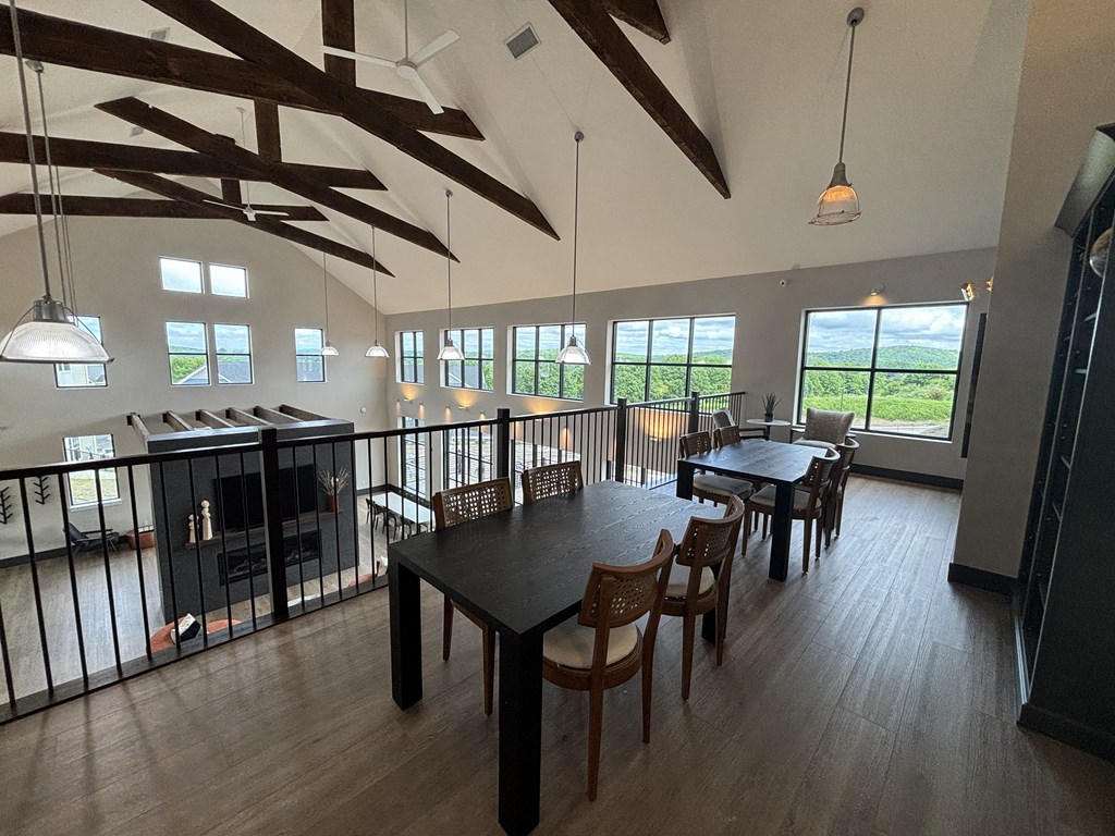 a view of the dining room and living room from the balcony