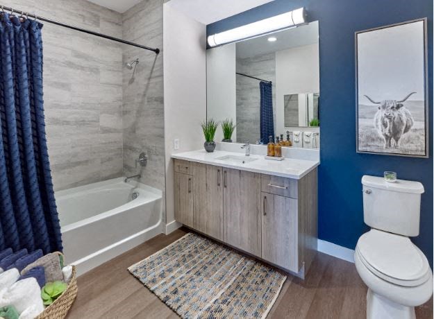 a bathroom with a toilet sink and bathtub