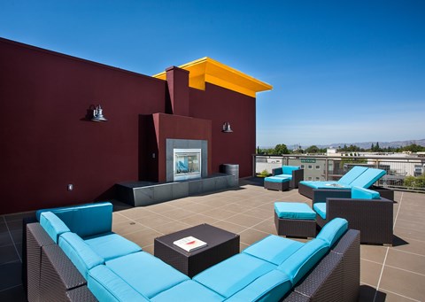 a rooftop lounge area on the roof of a building