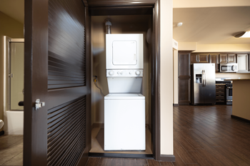 a washer and dryer in a room behind a door at Le Blanc Apartments, Canoga Park, CA, 91304
