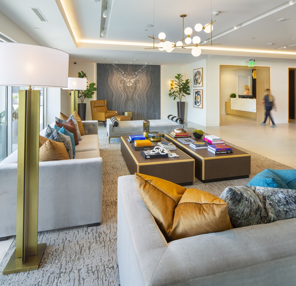 a large living room with couches and tables