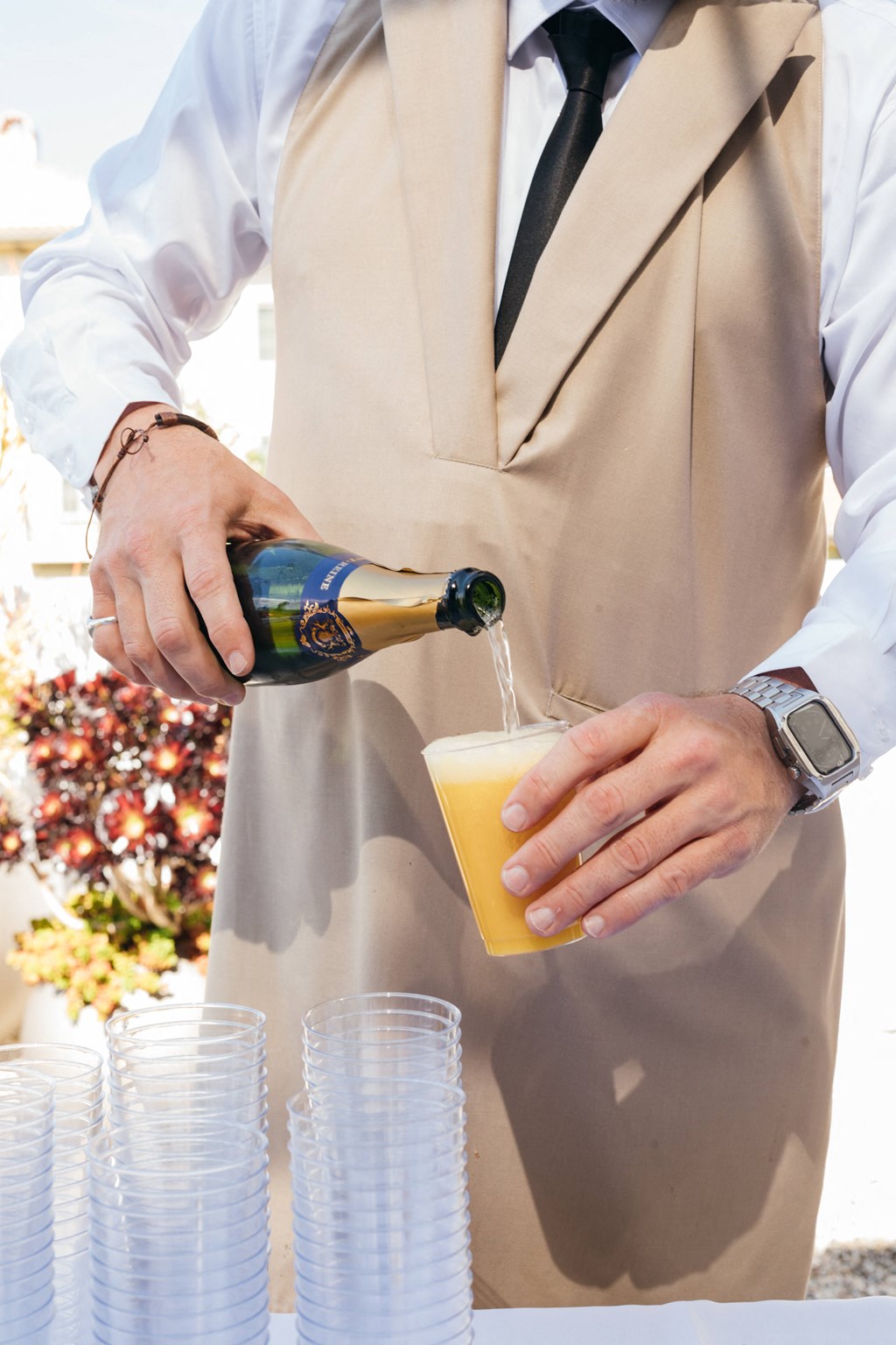a bartender pours a glass of beer