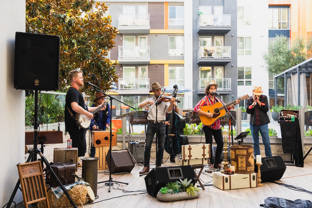 a group of musicians playing instruments on a stage