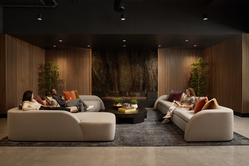 A modern living room with a large couch and a coffee table.