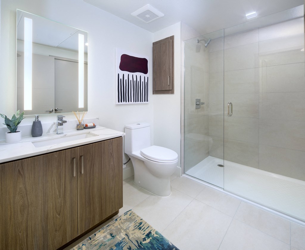 a bathroom with a toilet and a shower