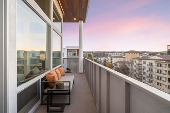 a balcony with a view of the city and the city skyline