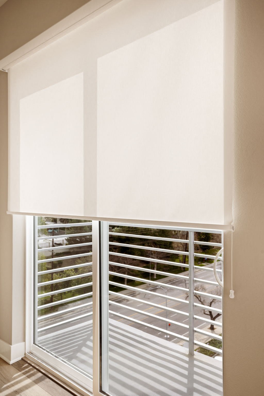 A white window with blinds is open.