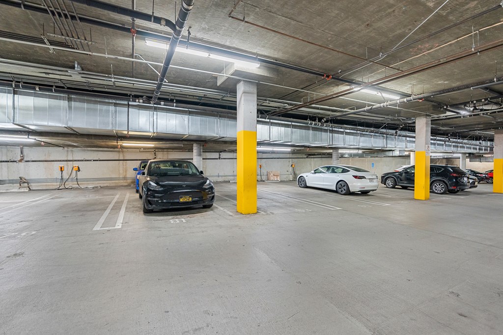 parking spaces in a parking garage with cars