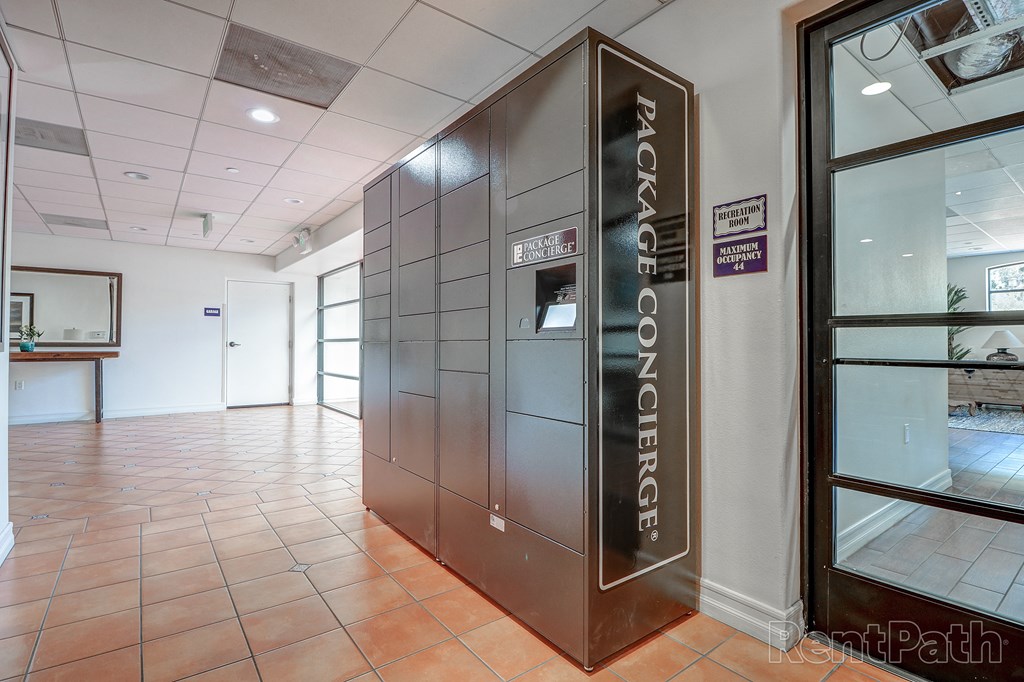 a stainless steel elevator in a lobby of a building