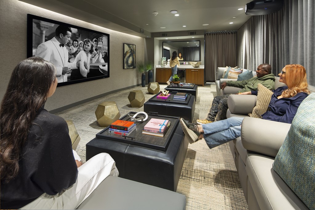 a living room filled with furniture and a large flat screen tv