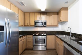 Gourmet Chef Kitchen with Stainless Steel Appliances at Legacy Apartments, California