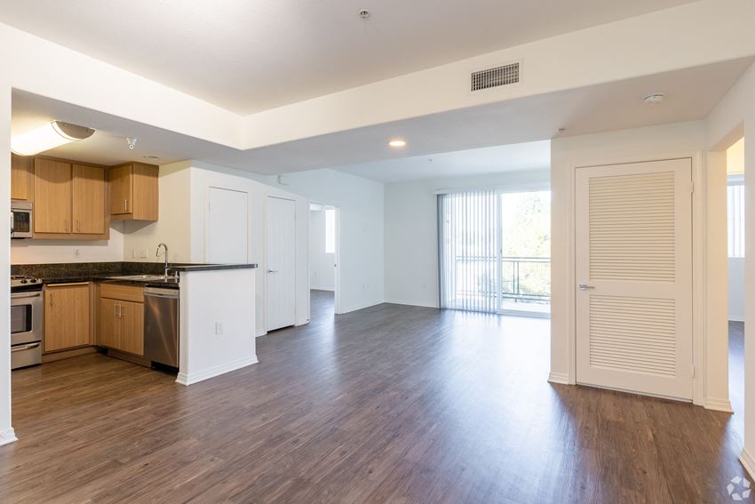 Open Living Room and Dining Room, High End Wood Laminate Flooring Open Living Room and Dining Room, High End Wood Laminate Flooring at Legacy Apartments, Northridge