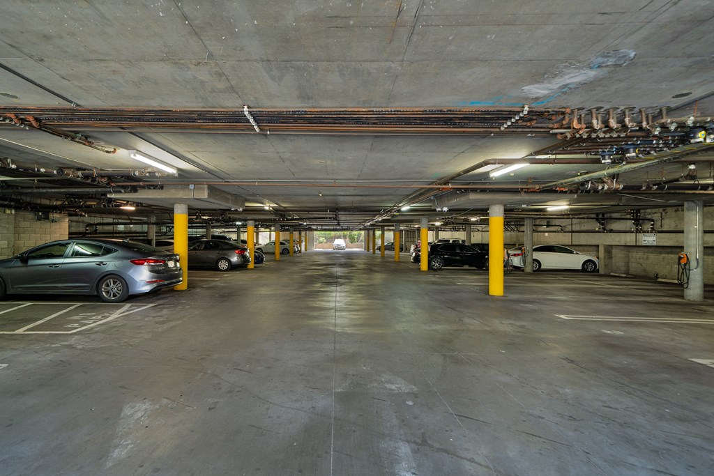 a parking garage with cars parked in it