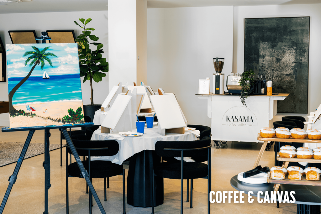 A painting of a beach scene is displayed in a room with a coffee and canvas theme.