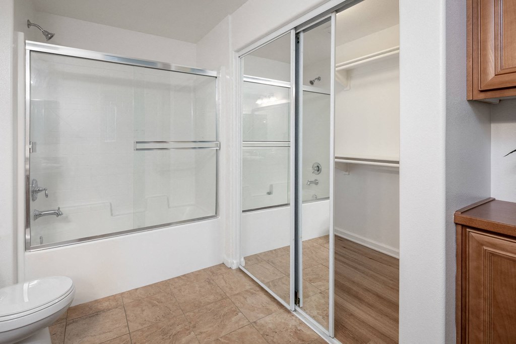 a bathroom with a shower and a toilet and a sink at Le Blanc Apartment Homes, Canoga Park, 91304